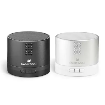 Caixa de som. Alumínio e ABS. Transmissão por bluetooth. Com 15 cristais Swarovski.