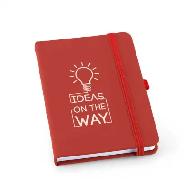 Bloco capa dura. C. sintético. Com porta esferográfica e 80 folhas pautadas. 90 x 140 mm