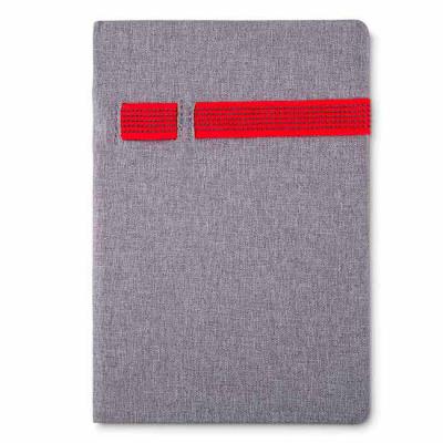 MSN Brindes - Caderno porta caneta e celular tecido sintético. Elástico colorido e caderno ciza, possui aproximadamente 80 páginas pardas pautadas. Medidas aproxima...