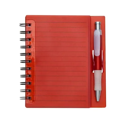 Bloco de anotações com caneta vermelho