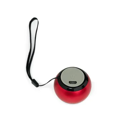 Caixa de som redonda vermelha