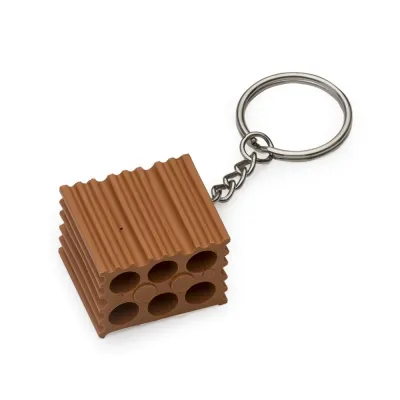 Chaveiro plástico formato tijolo, possui um lado liso ideal para personalização e o restante inte...