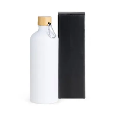 Garrafa em alumínio na cor branca com capacidade de 1 litro.Possui tampa rosqueável em Bambu com ...