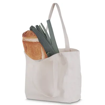 Sacola em algodão cru 180g/m². Alça com altura de 29 cm, ideal para transporte.