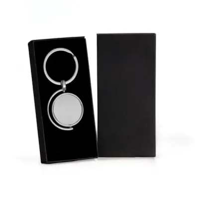 Chaveiro giratório em metal. Tipo de gravação: Uma gravação a Laser nos dois lados do chaveiro. D...